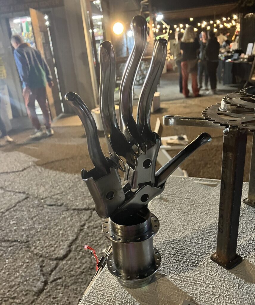 welded hand art at the art auction